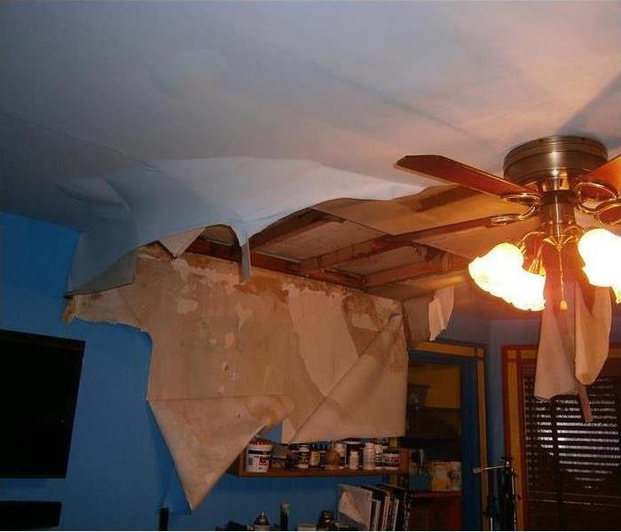 hanging ceiling material, bare timber visible from the water damage