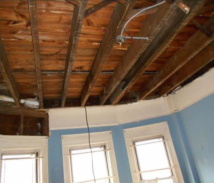 removed and cleaned ceiling, exposed sheathing, white window trim