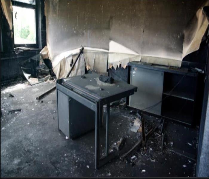 charred office equipment after a fire 